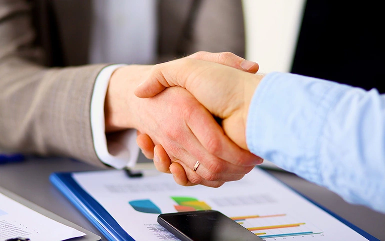 Business broker and customer shaking hands