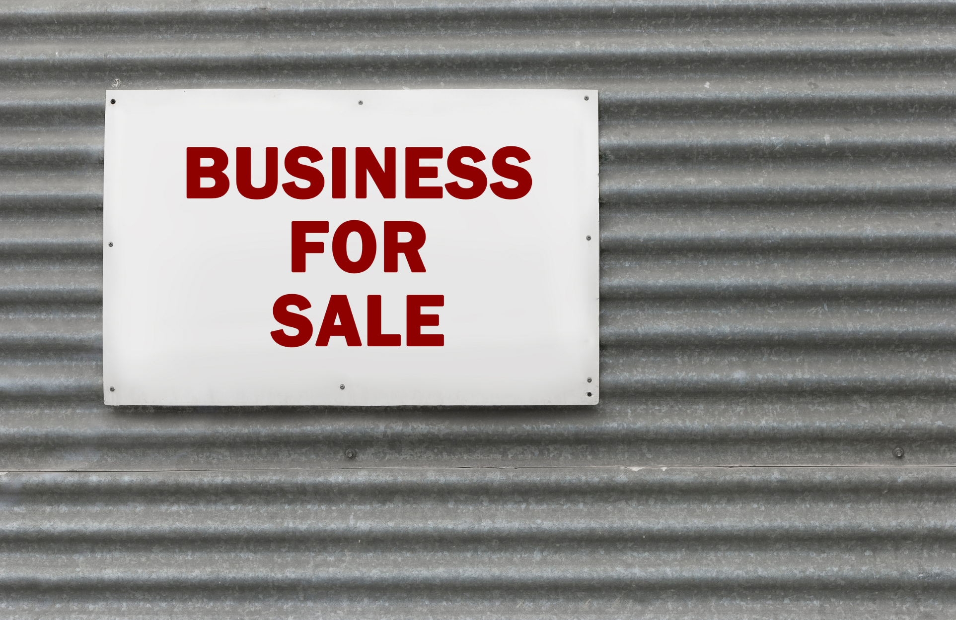 Business announcement for sale on the shop shutters